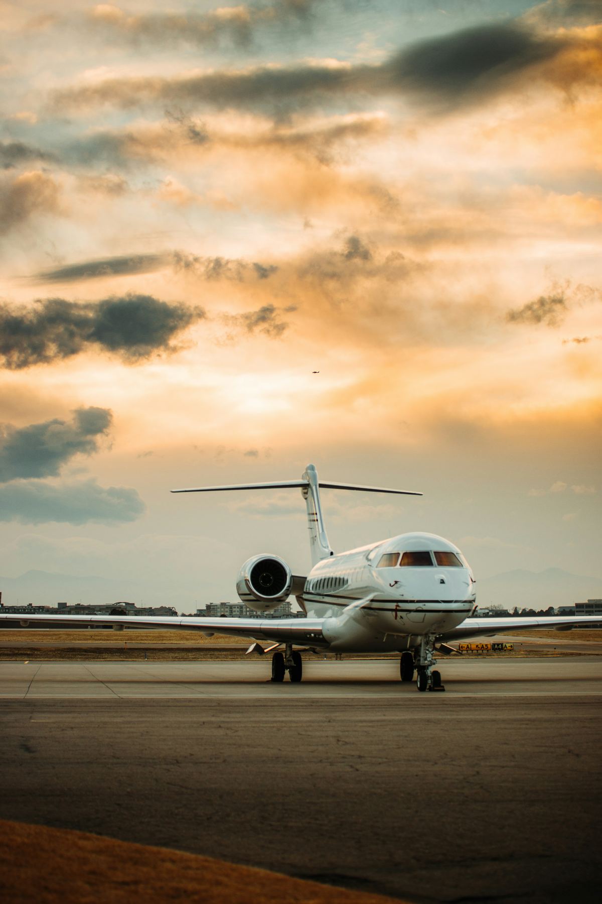 Private jet on the apron at dusk
