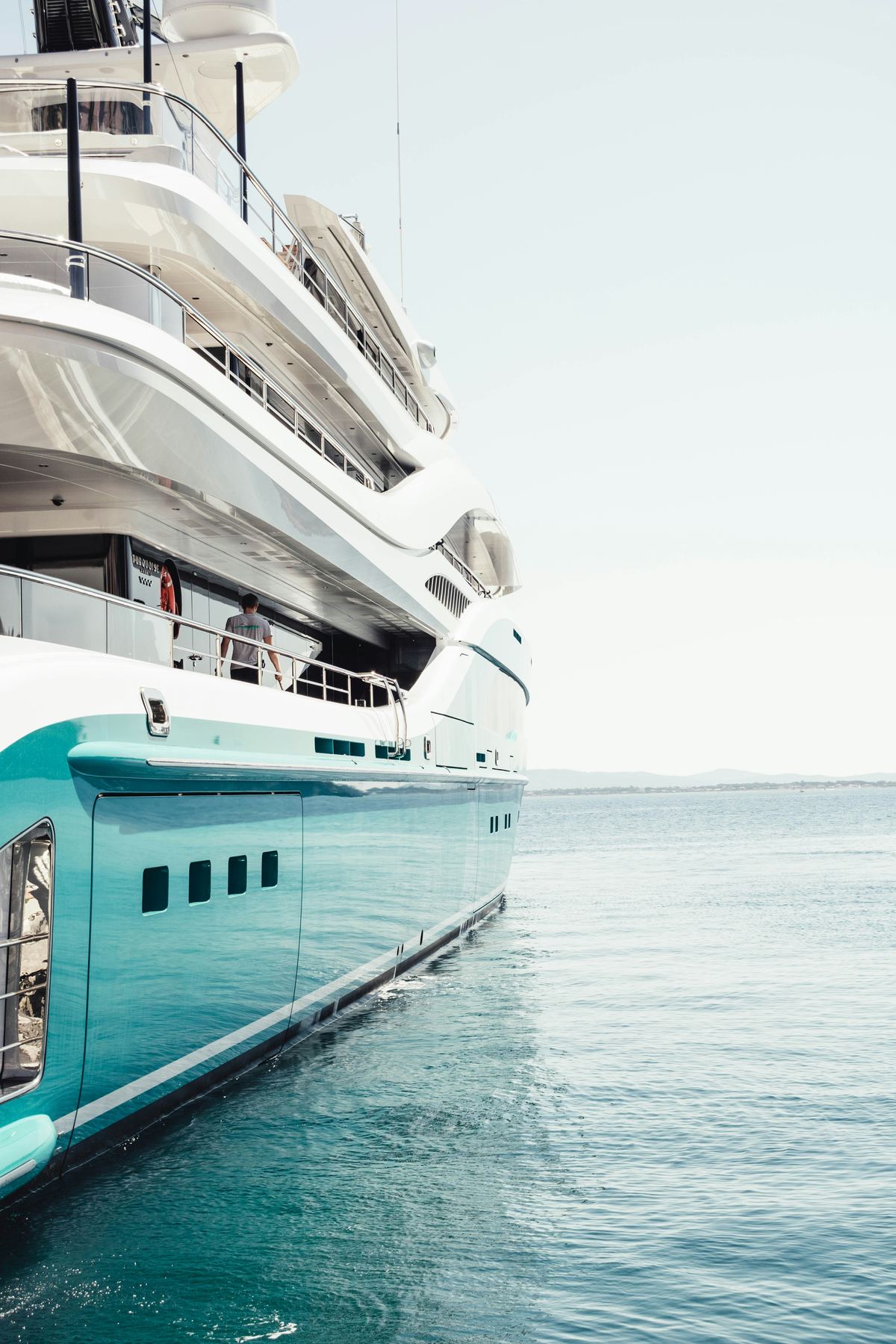 Superyacht at anchor on calm water